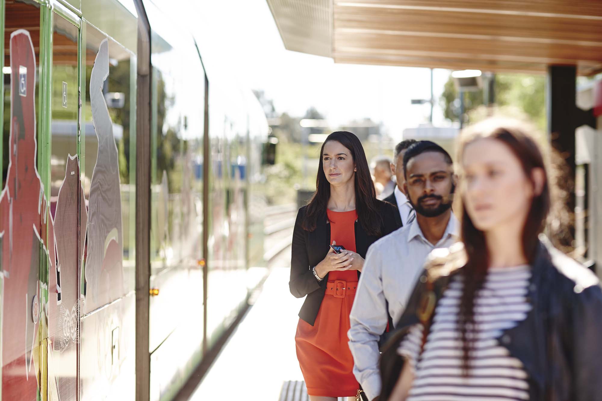 woman_at_light_rail_stop_opal.jpg