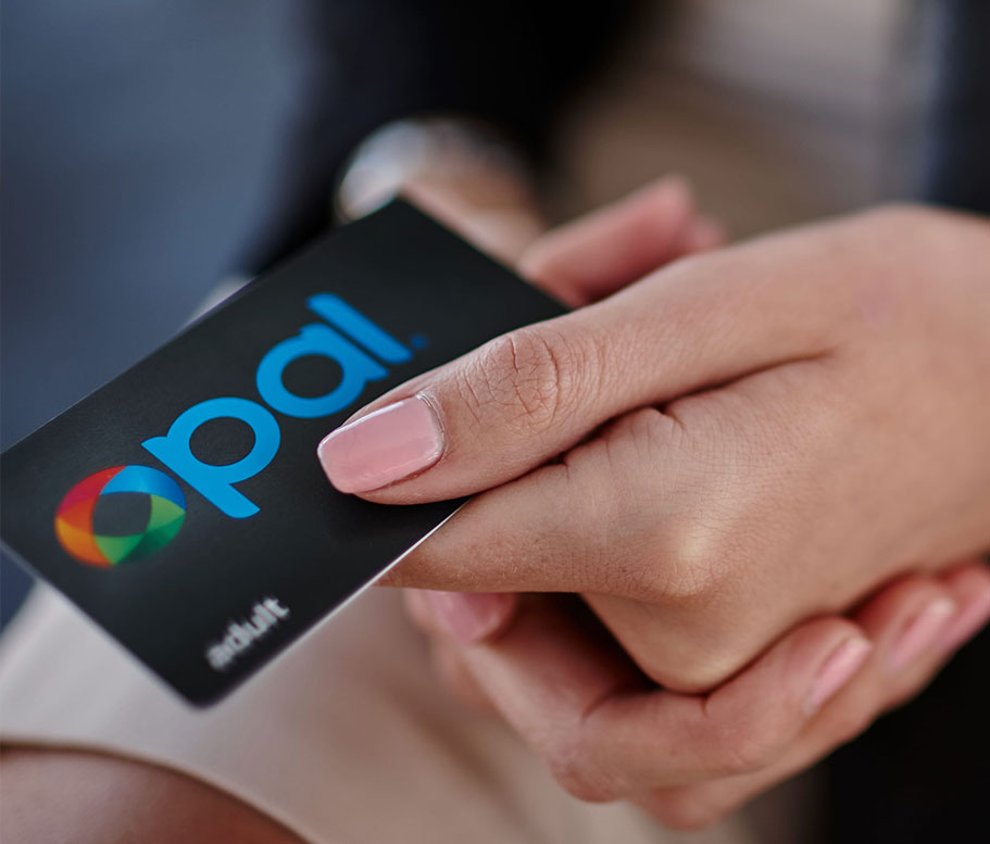 Adult Opal card held in a woman's hand.